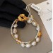 Baroque natural pearl double lotus leaf designer bracelet for women light luxury retro bracelet niche premium Hand sensation